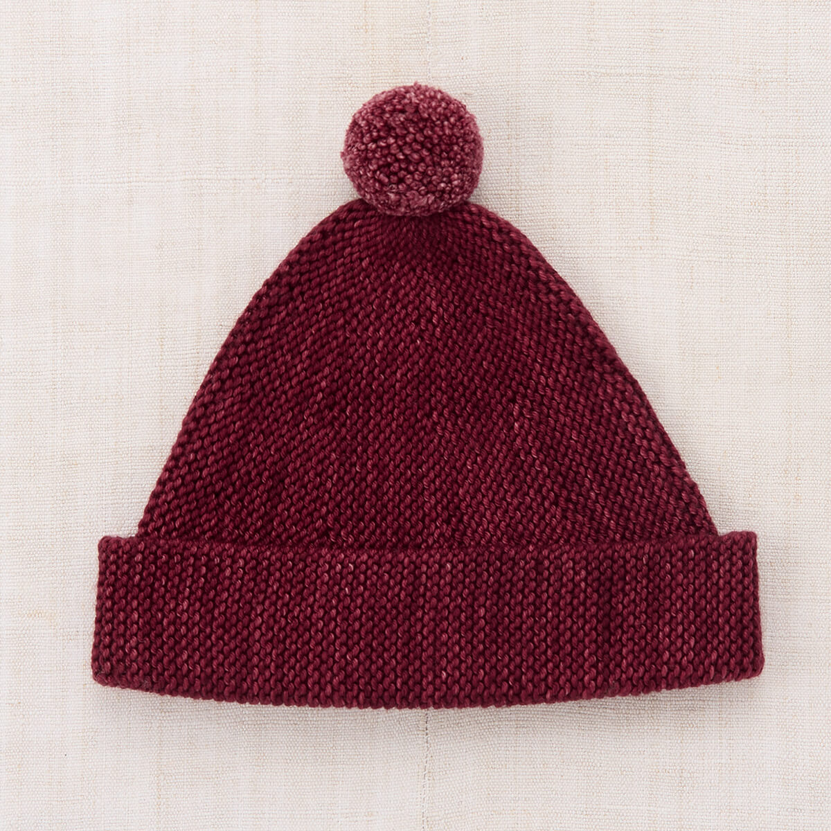 Bonnet en maille jersey classique en laine mérinos de Cambridge avec bord ajustable et pompon pour enfants de 2 à 9 ans