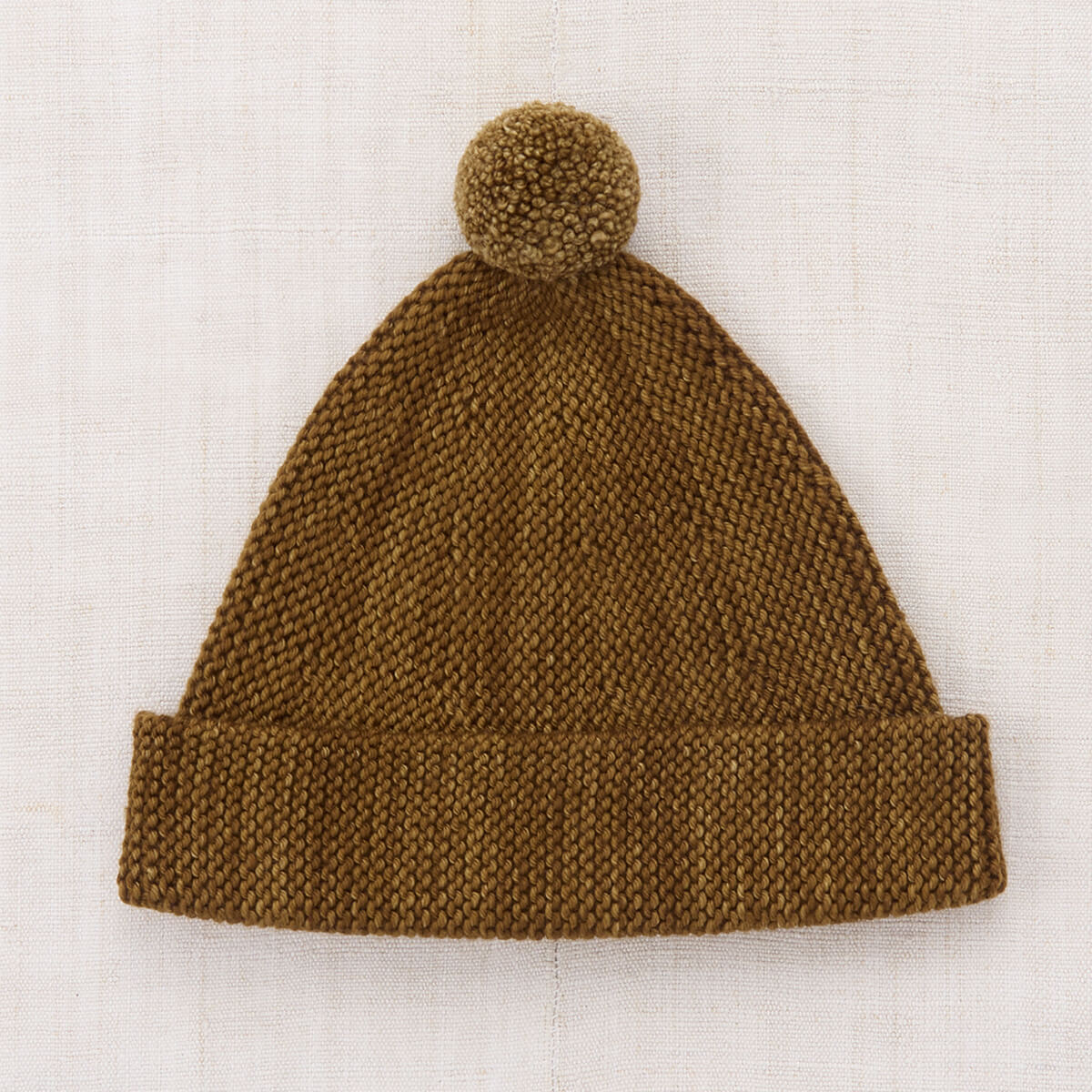 Bonnet tricoté en laine mérinos muscade classique avec bord réglable et pompon pour enfants de 2 à 9 ans