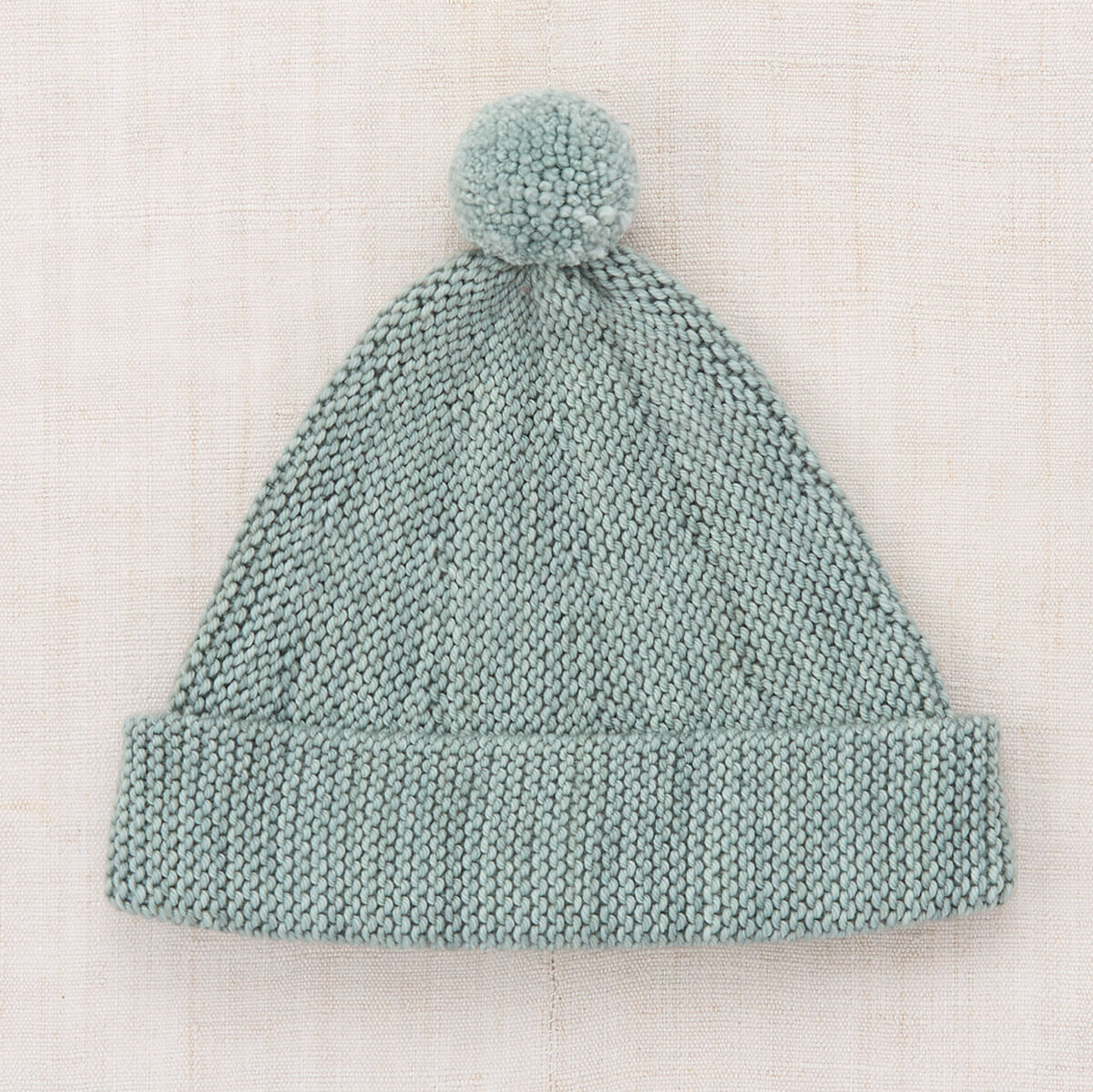 Bonnet enfant Onsen classique en laine mérinos tricoté au point de jarretière, avec bord réglable et pompon, pour les 2-9 ans