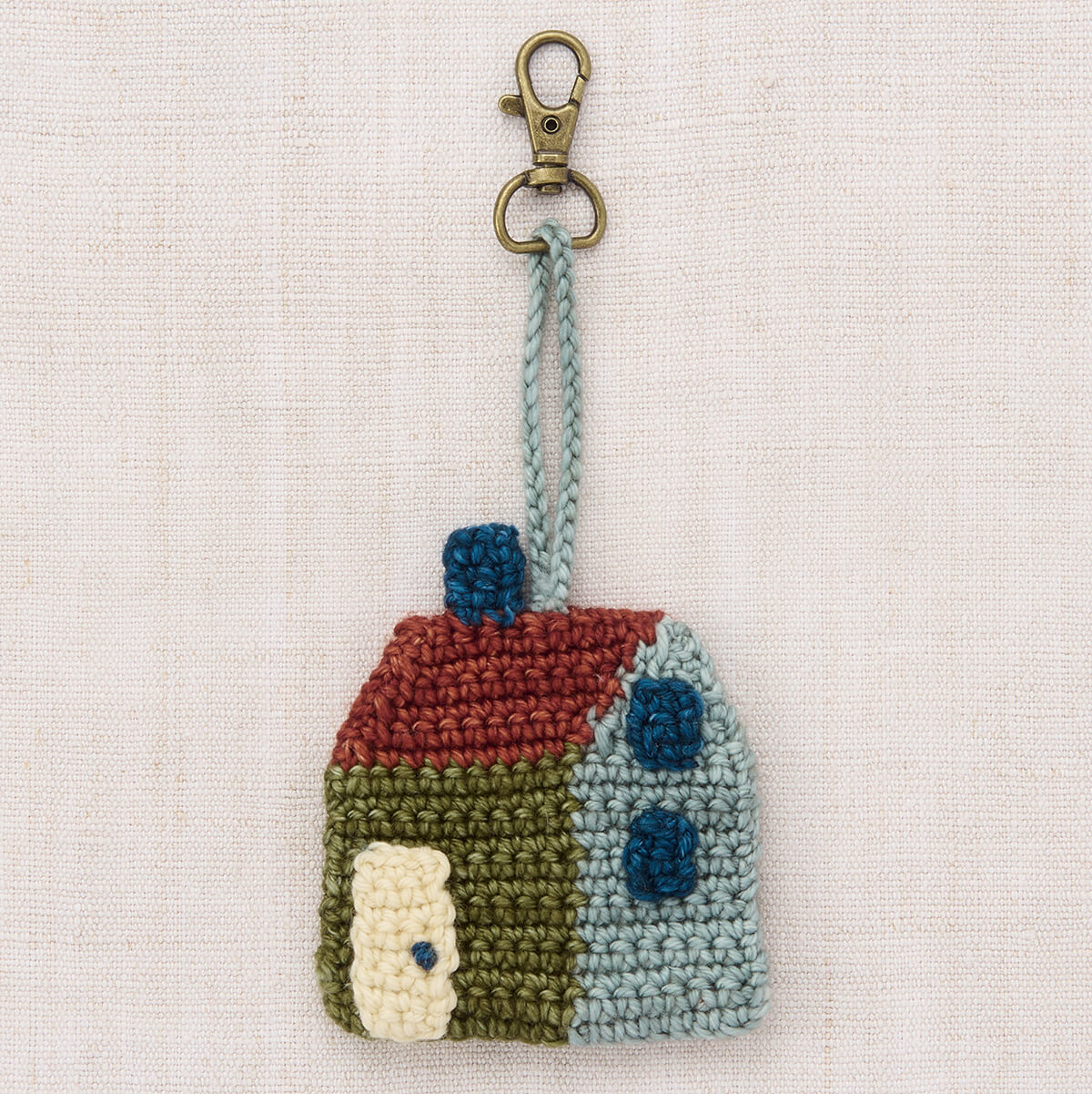 Breloque de sac en laine mérinos crochetée à la main au design ludique pour sacs et clés